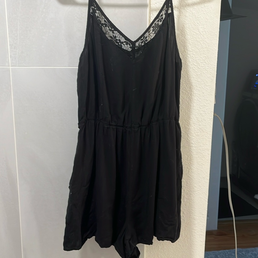Black romper with lace trim